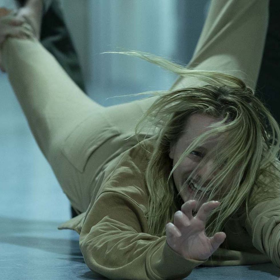 invisible man dragging Cee, played by Elisabeth Moss, in 'The Invisible Man'