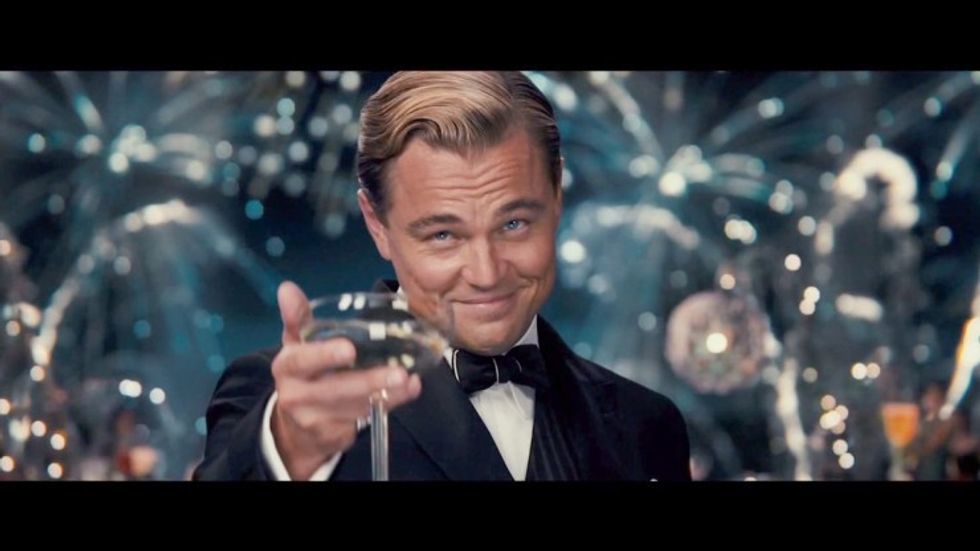 Jay Gatsby, played by Leonardo DiCaprio, toasting his glass in 'The Great Gatsby'