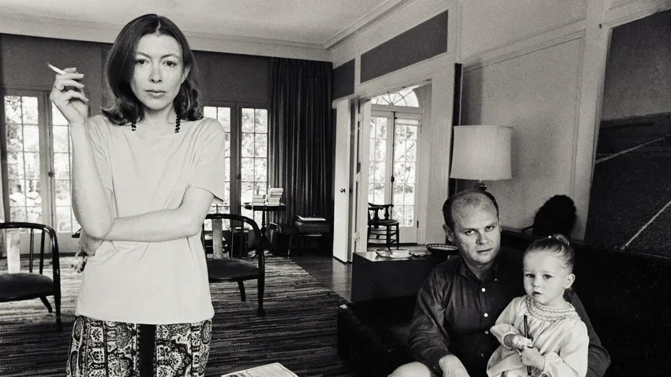 Joan Didion, her husband, a toddler in a living room in 'Joan Didion: The Center Will Not Hold'