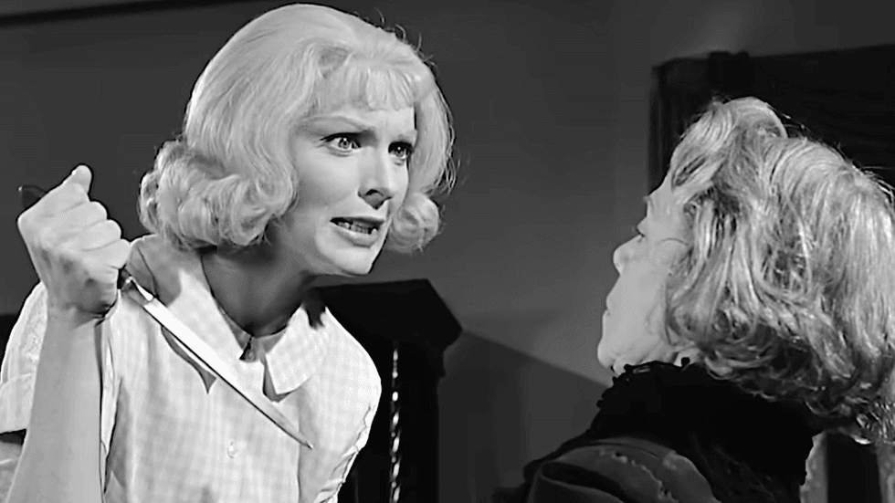 Joan Marshall holding a knife next to Eugenie Leontovich in a scene from Homicidal (1961)