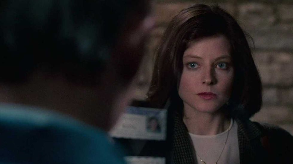 Jodie Foster as Clarice holding out her credentials in The Silence of the Lambs
