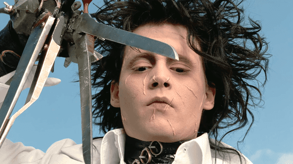 Johnny Depp portrays the title character Edward Scissorhands in the 1990 gothic fantasy film Edward Scissorhands