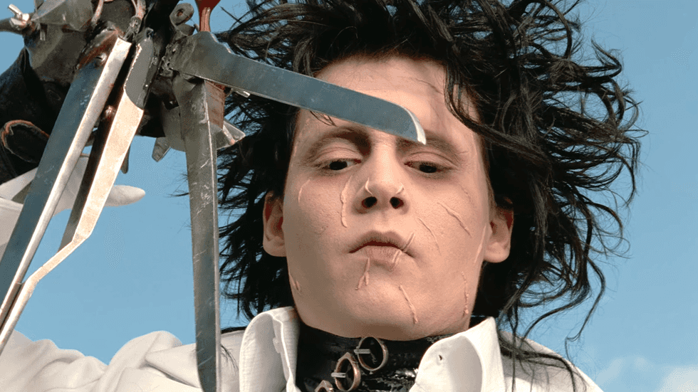 Johnny Depp portrays the title character Edward Scissorhands in the 1990 gothic fantasy film Edward Scissorhands