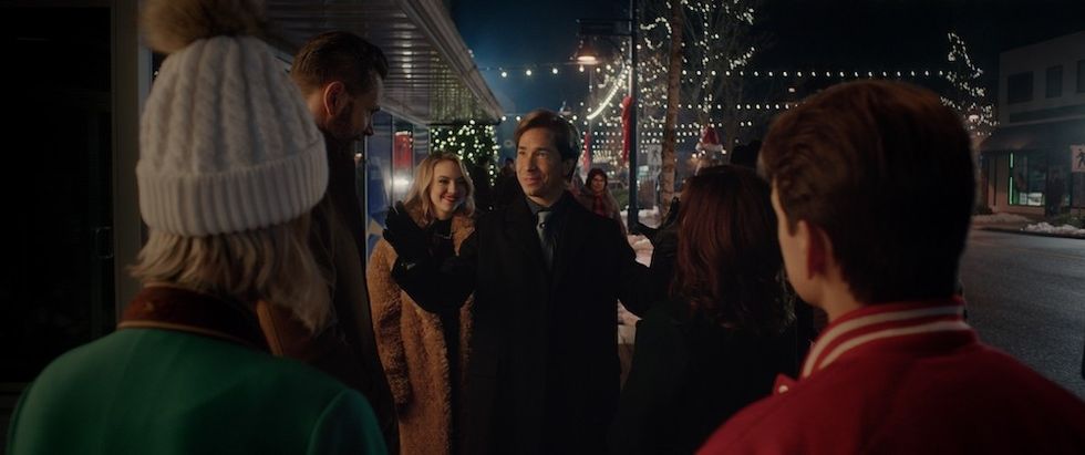 Justin Long grinning at group