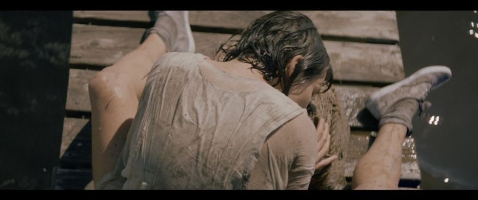 Kaija Matiss Carrying 50lb Rock in Detritus