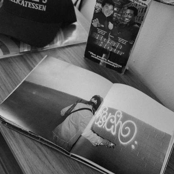 katz's delicatessen hat and open magazine on table