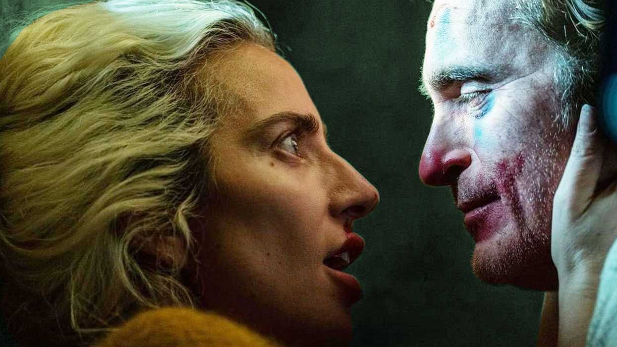 Lady Gaga as Harley Quinn holding the face of Joaquin Phoenix as Arthur Fleck in 'Joker: Folie à Deux'