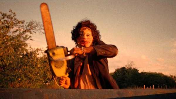 Leatherface chasing a truck with a chainsaw in The Texas Chain Saw Massacre