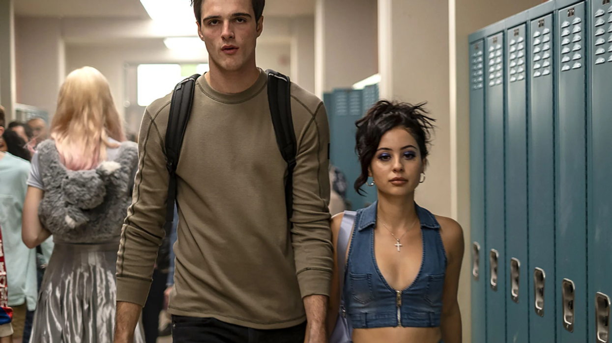 Maddy, played by Alexa Demie, and Nate, played by Jacob Elordi, walking down a high school hallway in 'Euphoria'