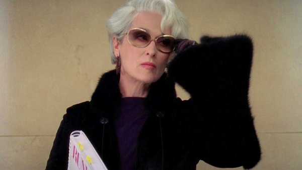 Meryl Streep as Miranda Priestly adjusting her glasses in the elevator in The Devil Wears Prada