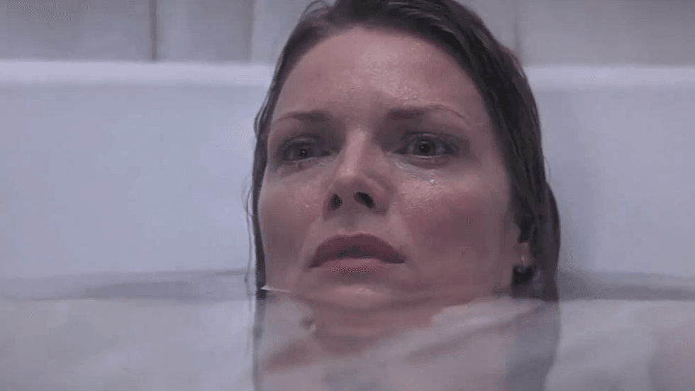 Michelle Pfeiffer is in a bathtub in the 2000 supernatural thriller What Lies Beneath