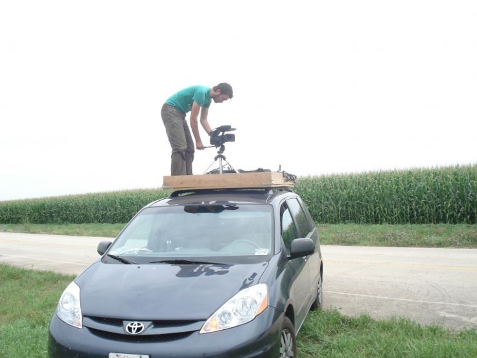 Mike Ambs on set before permanently securing the crane to the roof of the production van.