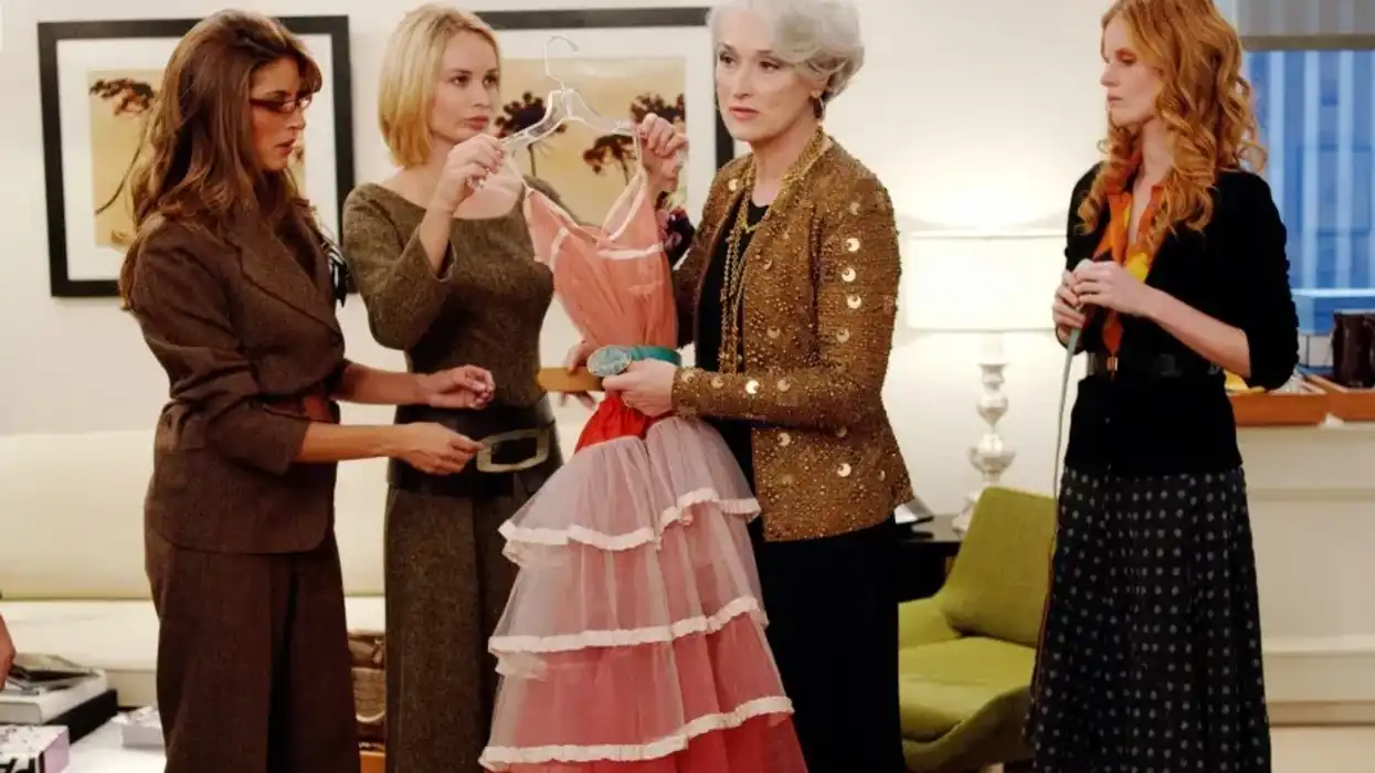 Miranda Priestly, played by Meryl Streep, holding a cerulean blue belt to a pink dress in 'The Devil Wears Prada'