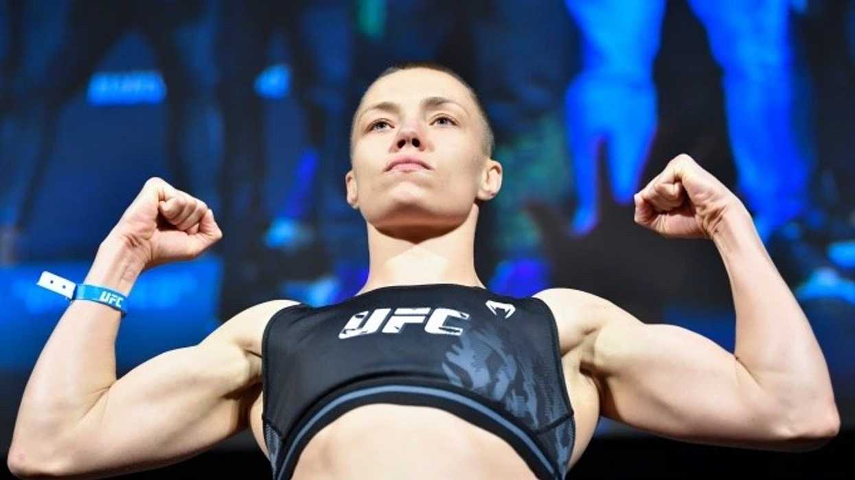 MMA fighter Rose Namajunas flexing her muscles in the ring