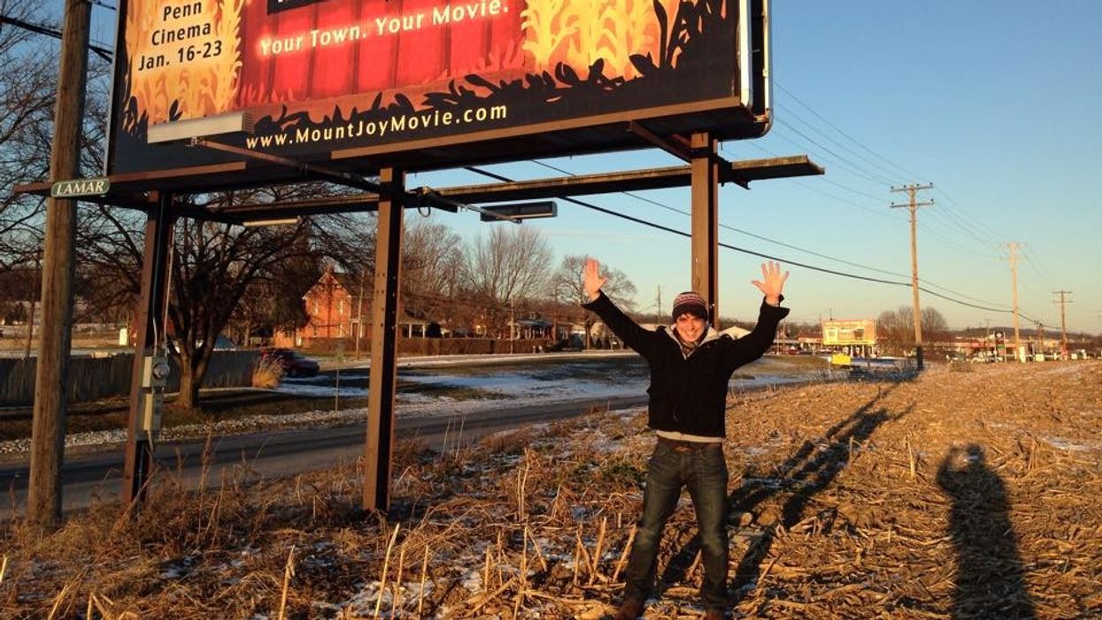 Mount Joy Writer M. Angelo Mena by a Billboard in Lancaster, PA