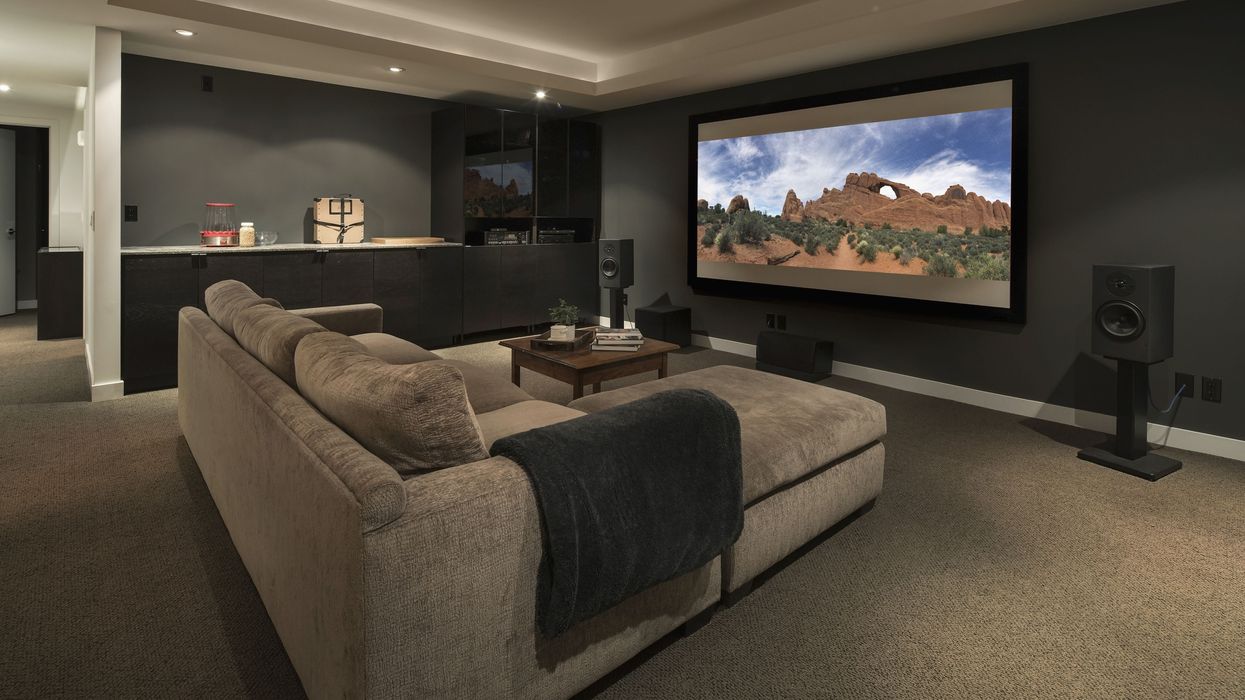 Movie-playing-on-projection-screen-in-home-theater-915093896-5bdb7eb0c9e77c0026d2970f