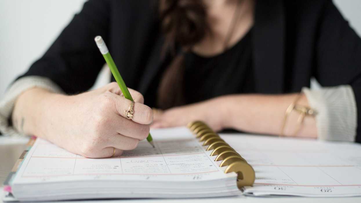 Negative-space-notebook-write-desk-hands-2048x1365