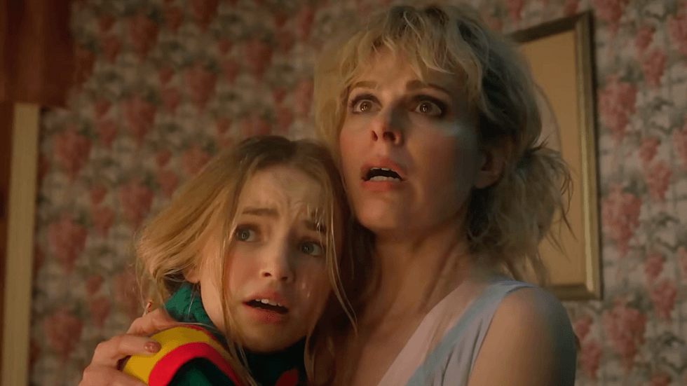 Nell Fisher as Holly Wheeler (left) and Cara Buono as Karen Wheeler (right) in a scene from Stranger Things Season 5