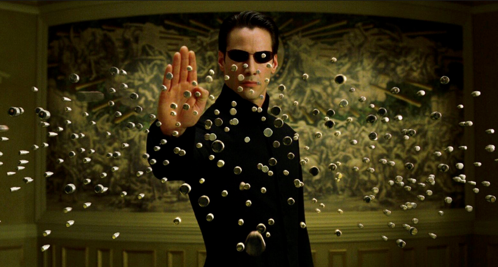 Neo, played by Keanu Reeves, stoping bullets in 'The Matrix'