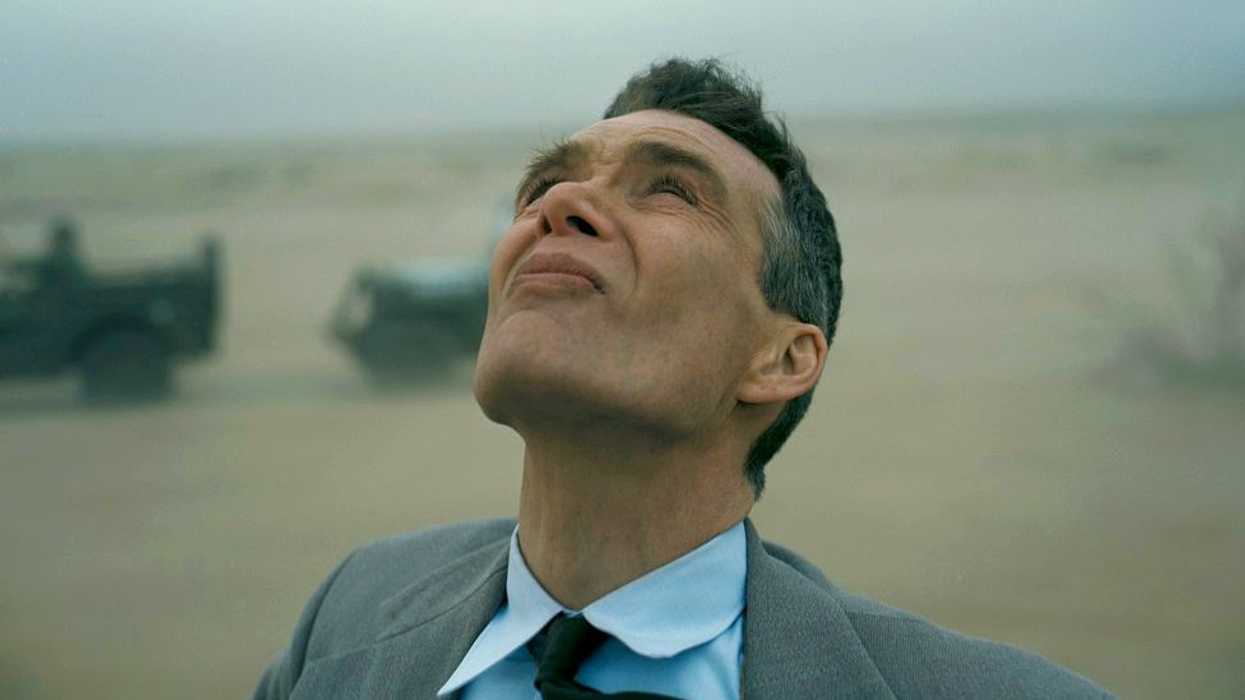 Oppenheimer, played by Cillian Murphy, looking at the atomic bomb in 'Oppenheimer'