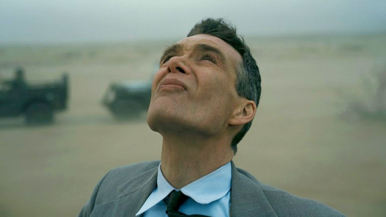 Oppenheimer, played by Cillian Murphy, looking at the atomic bomb in 'Oppenheimer' 
