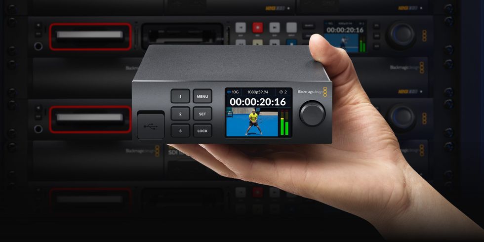 picture of hand hold a Blackmagic 2110 IP Converter