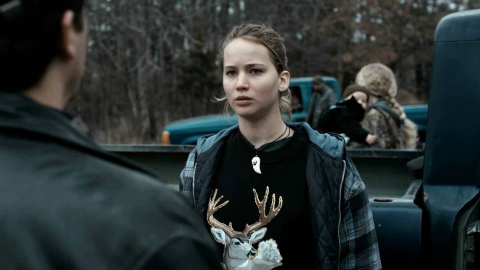 Ree Dolly, played by Jennifer Lawrence, standing infront of a truck in 'Winter's Bone'