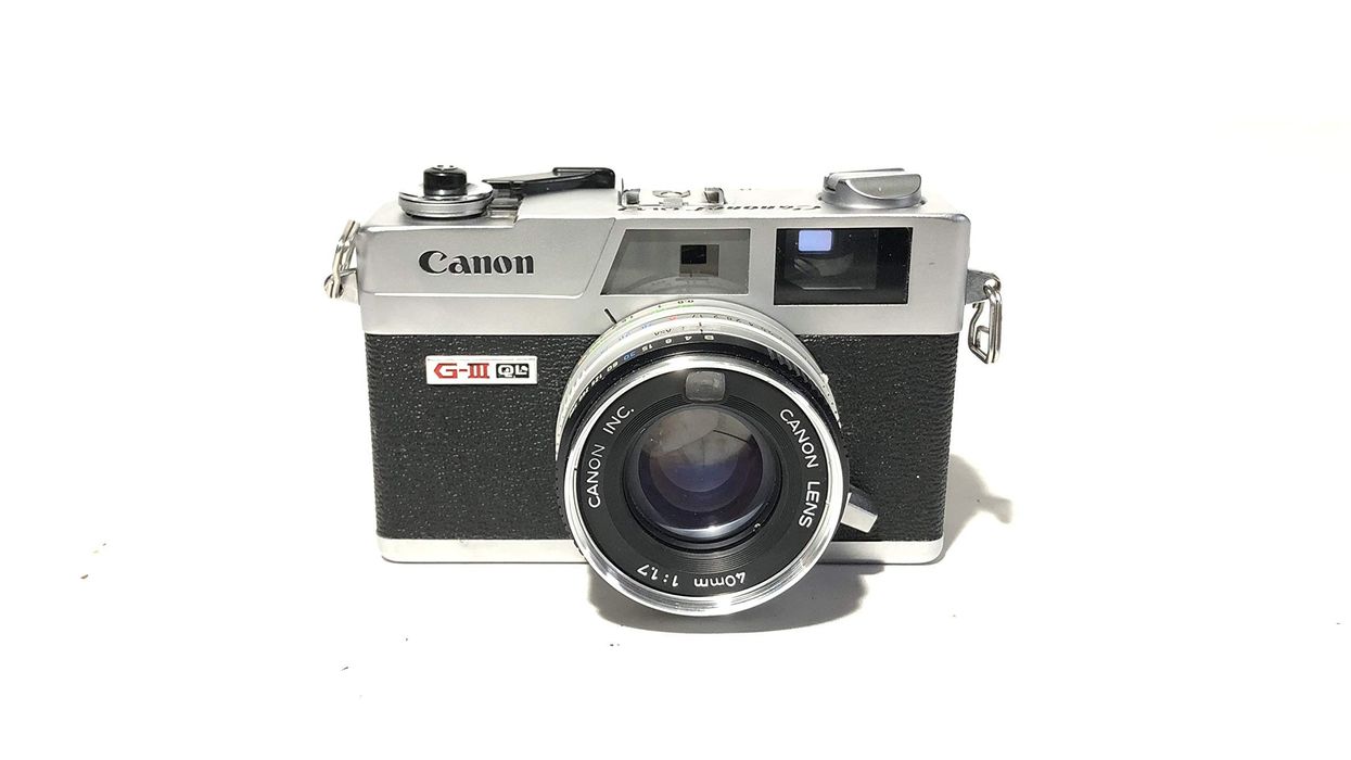 Retro canon camera on a white background