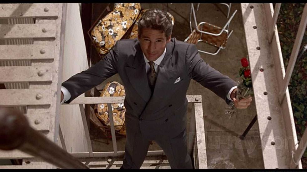 Richard Gere portraying the character Edward Lewis in a famous scene from the 1990 rom-com Pretty Woman