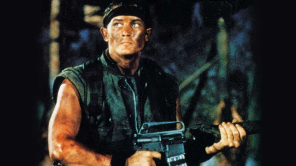 Robert Patrick holding a gun in Killer Instinct