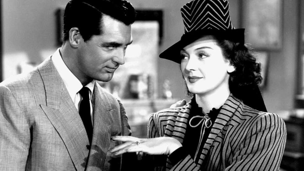 Rosalind Russell holding her hand out to Cary Grant in His Girl Friday