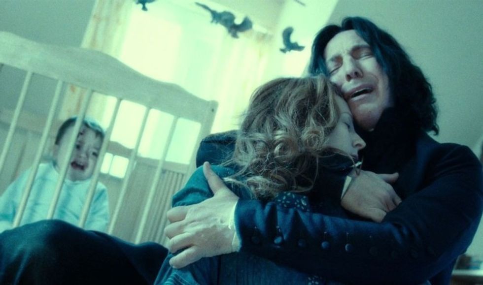 Snape, played by Alan Rickman, holding Lily's body in "Harry Potter and the Deathly Hallows Part 2