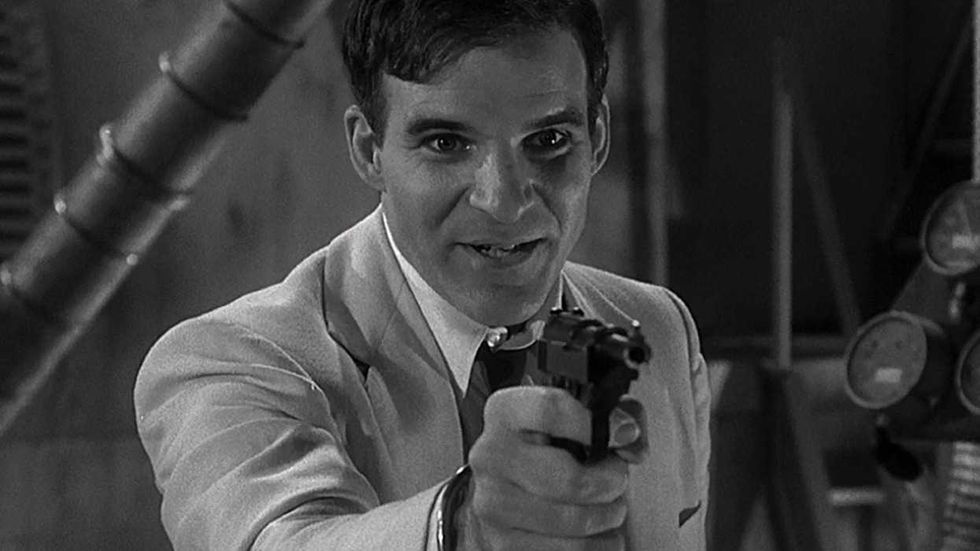 Steve Martin pointing a gun in Dead Men Don't Wear Plaid