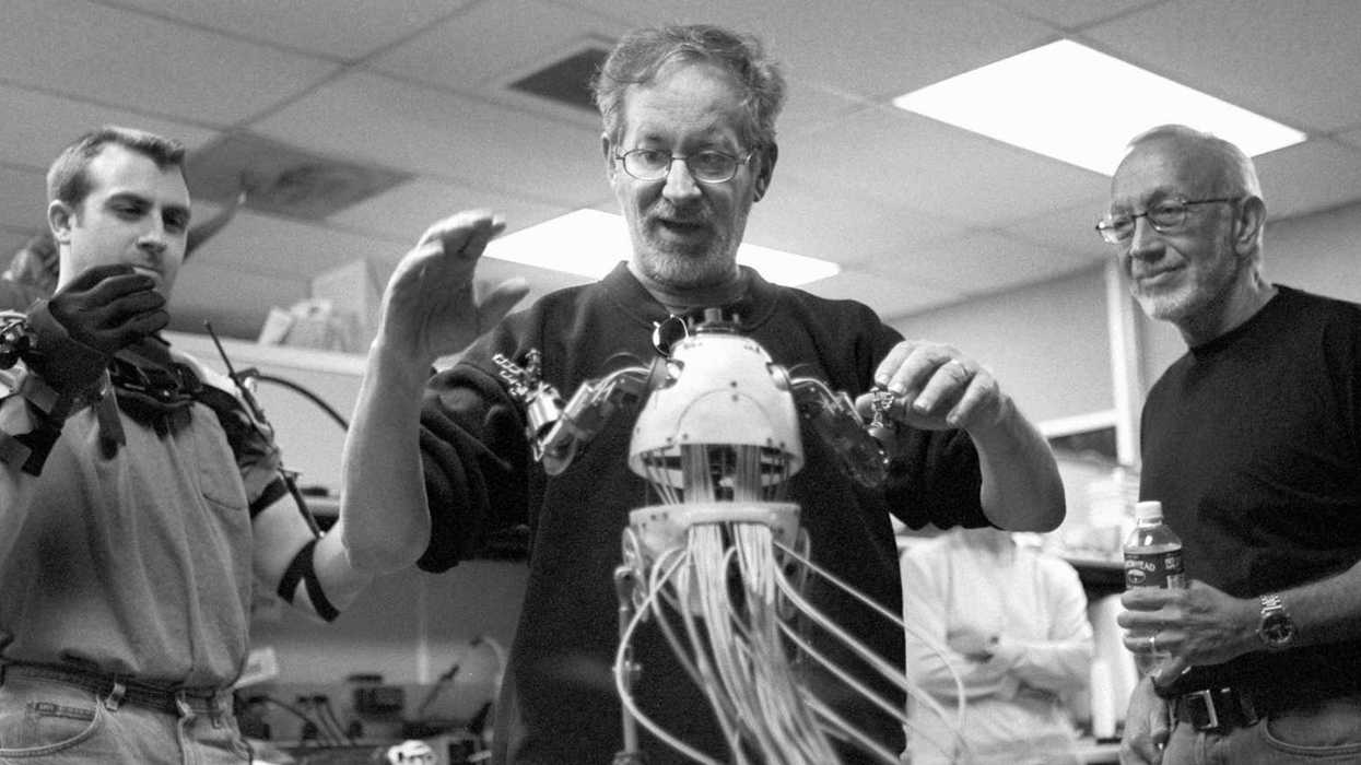 Steven Spielberg reacts to a mechanical demonstration of the Teddy supertoy by SWS mechanical designer Matt Heimlich, as Stan Winston looks on.
