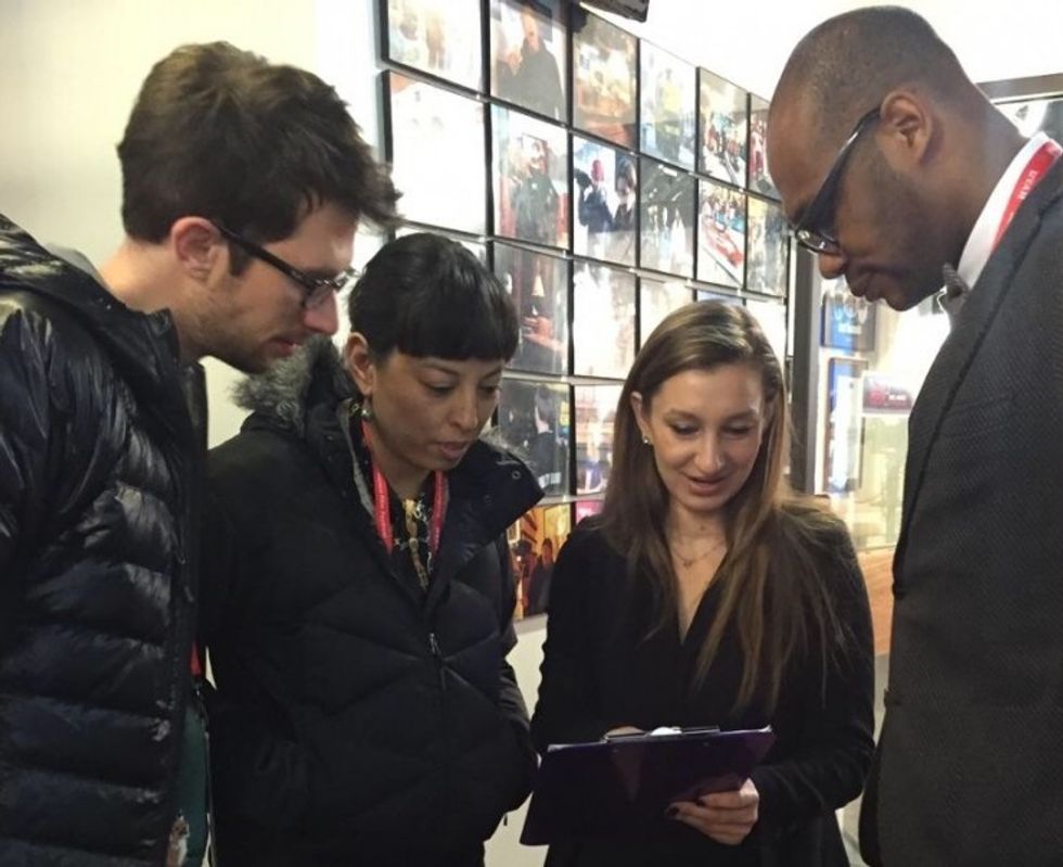 Susan Szotyori organizing an interview with the filmmakers of