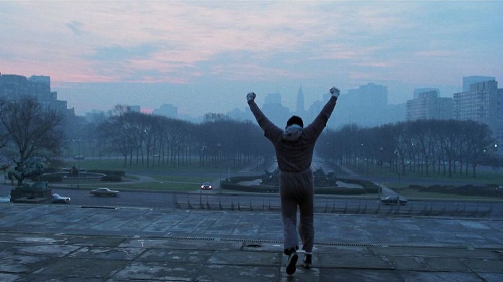 Sylvester Stallone as Rocky, finishing his run at the Philadelphia Museum of Art