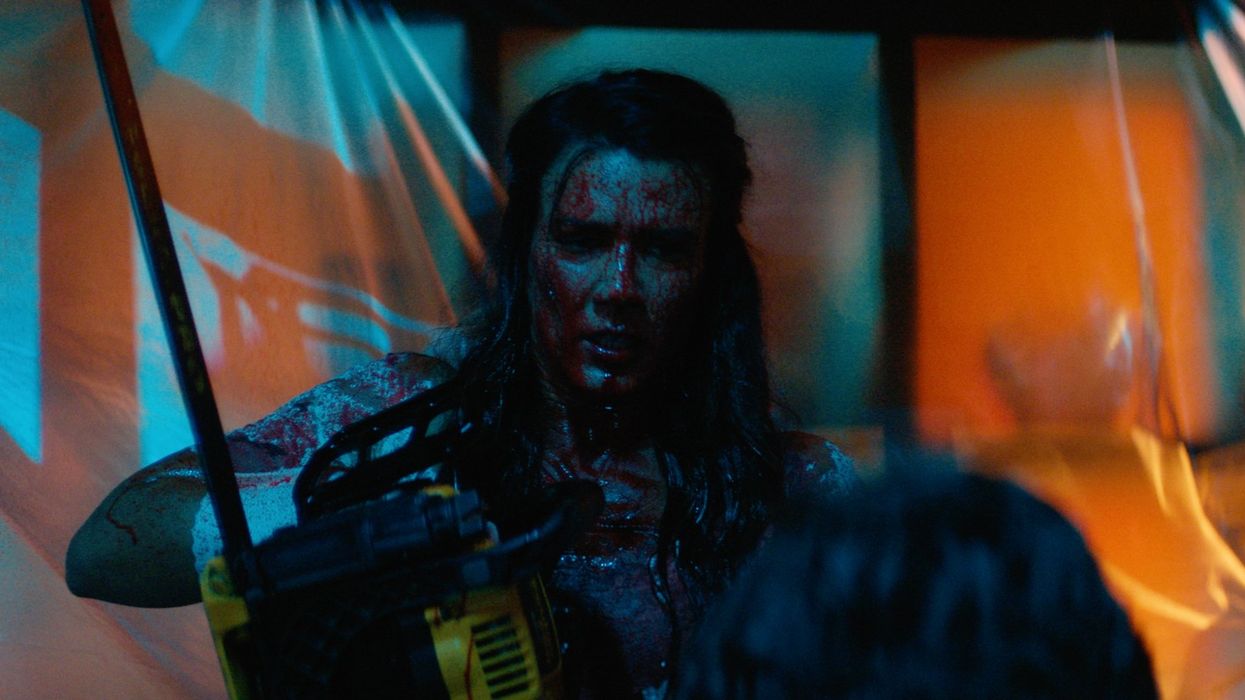 The bride, played by Natalie Burn, covered in blood while holding a chainsaw in 'Til Death Do Us Part'