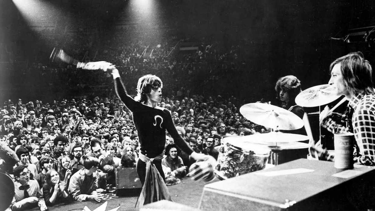 The Rolling Stones rock band performing on the stage.