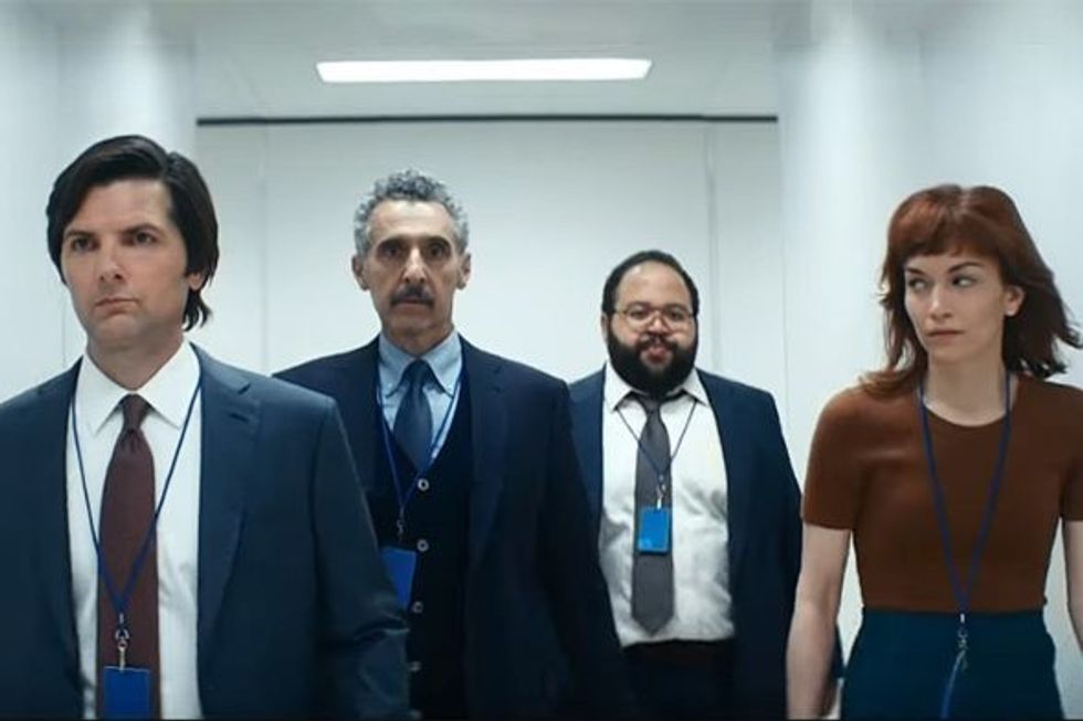 Three men and a woman walking down a white hallway, 'Severance'