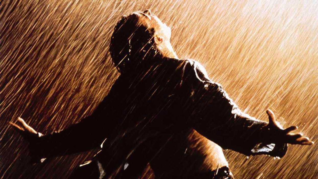 Tim Robbins as Andy Dufresne tilting his head to the rain in The Shawshank Redemption