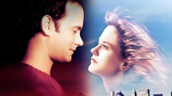 Tom Hanks and Meg Ryan's faces in the sky on the poster for Sleepless in Seattle