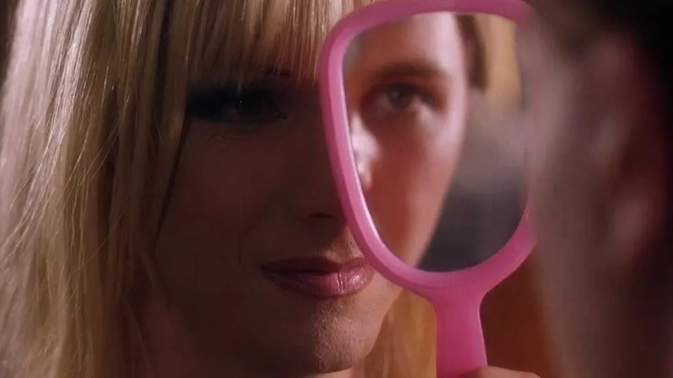 Tommy Gnosis looking into a mirror that Hedwig is holding in Hedwig and the Angry Inch