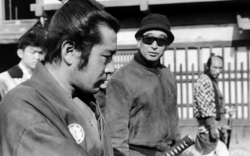 Toshiro Mifune (left), Akira Kurosawa (right) on the set of \u2018Yojimbo\u2019