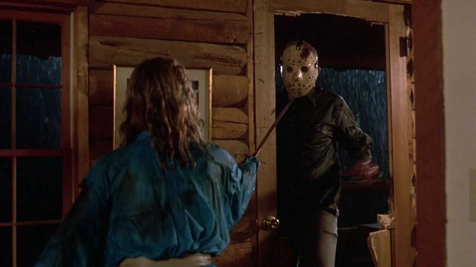 Trish brandishing a poker at Jason in Friday the 13th: The Final Chapter