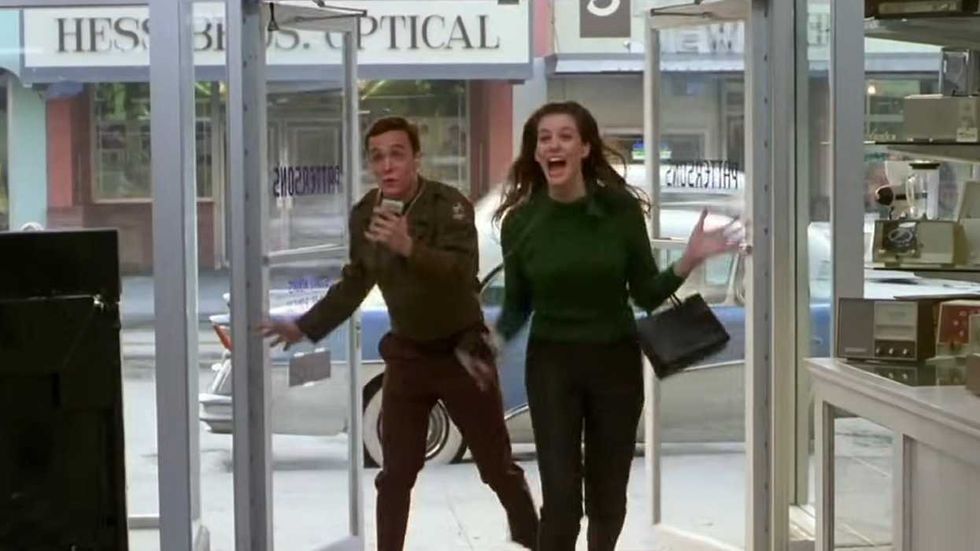 Two characters rushing into a storefront in That Thing You Do