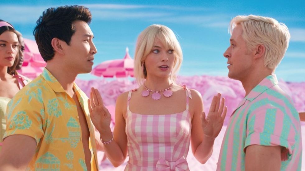 Two Kens arguing with a Barbie breaking them up, 'Barbie'