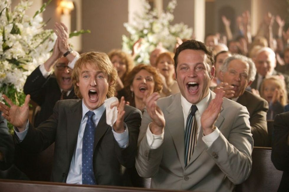 Two men cheering at a wedding in 'Wedding Crashers'