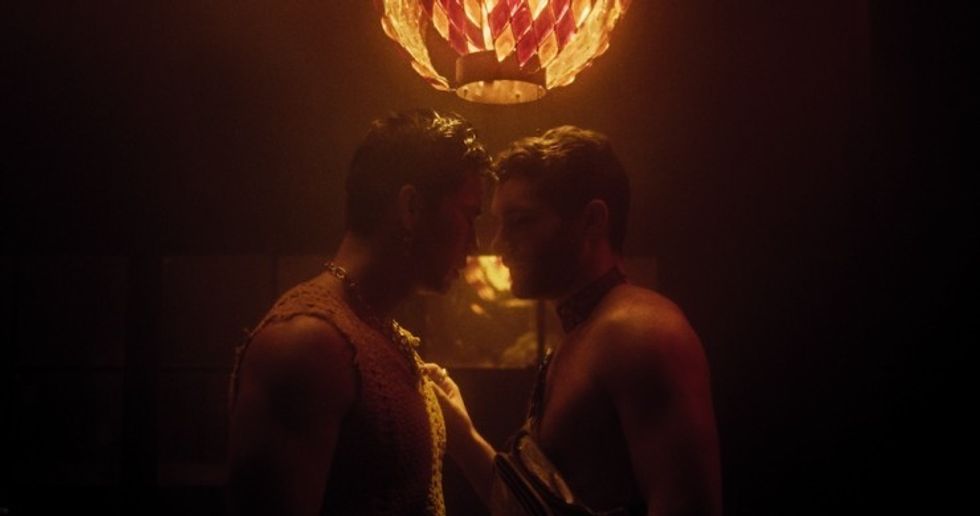 Two men embrace, Julia Ponce Diaz