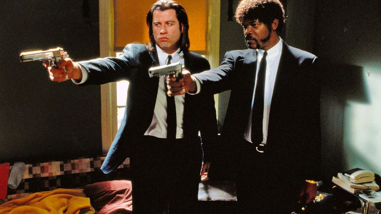 Vincent Vega, played by John Travolta, and Jules Winnfield, played by Samuel L. Jackson, pointing guns in 'Pulp Fiction'