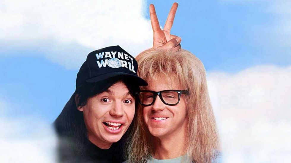 Wayne giving Garth bunny ears on the poster for Wayne's World 2